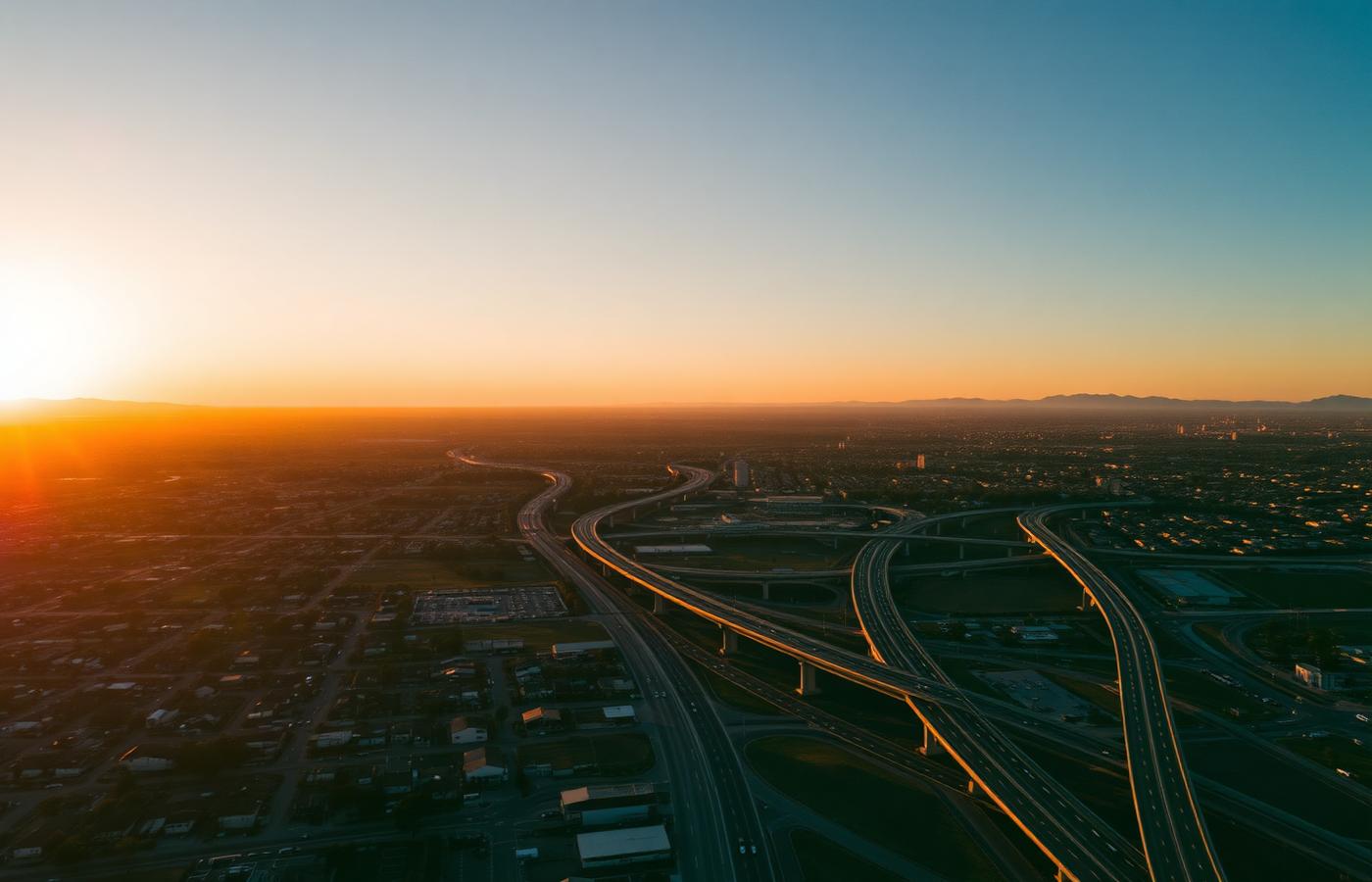 Aerial view of Orange County California suburban housing and freeways at sunset